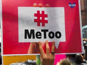 A South Korean demonstrator holds a banner during a rally to mark International Women's Day as part of the country's #MeToo movement in Seoul on March 8, 2018.