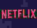 In this file photo taken on June 28, 2019 Netflix logo is seen on the backdrop of Netflix's 