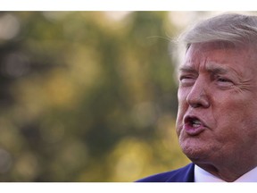 US President Donald Trump speaks to the press from the South Lawn of the White House after announcing and initial deal with China in Washington, DC, prior to departing to Lake Charles, Louisiana to hold a campaign rally on October 11, 2019.