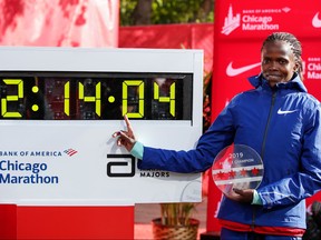 Kenya's Brigid Kosgei smiles after winning the women's 2019 Bank of America Chicago Marathon with the World Record on October 13 2019 in Chicago, Illinois. (KAMIL KRZACZYNSKI/AFP via Getty Images)