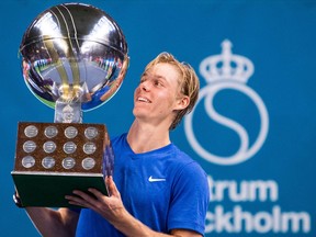 Canada's Denis Shapovalov poses with his trophy after winning the ATP Stockholm Open tennis tournament following his victory against Serbias Filip Kranjinovic on October 20, 2019 in Stockholm. (Photo by Jonathan NACKSTRAND / AFP)