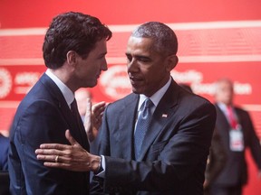 This handout photo taken on November 20, 2016 and released by the official APEC Peru 2016 organisation shows US President Barack Obama (R) chatting to Canada's Prime Minister Justin Trudeau (L) as they attend the first APEC Leaders' Retreat on the final day of the Asia-Pacific Economic Cooperation (APEC) Summit in Lima.