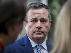 Alberta is introducing legislation to bring a British law to the province that allows people in abusive relationships to request information about a partner's criminal record. Alberta Premier Jason Kenney speaks to the media while attending the Global Business Forum in Banff, Alta., Thursday, Sept. 26, 2019.