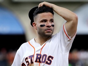 Jose Altuve of the Houston Astros reacts against the Washington Nationals during Game 2  of the World Series at Minute Maid Park on October 23, 2019 in Houston. (Elsa/Getty Images)