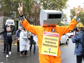 Demonstrators protest outside Westminster Magistrates Court in London on October 21, 2019, where WikiLeaks founder Julian Assange has been attending a case management hearing as he fights extradition to the United States. (ISABEL INFANTES/AFP via Getty Images)