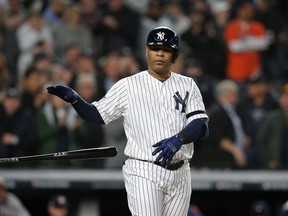 New York Yankees designated hitter Edwin Encarnacion walks to load the bases against the Houston Astros during the first inning in game four of the 2019 ALCS playoff baseball series at Yankee Stadium.