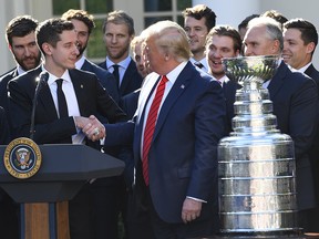 President Donald Trump shakes the hand of St. Louis Blues goalie Jordan Binnington after welcoming the 2019 Stanley Cup champions, the St. Louis Blues, to The White House on Tuesday, October 15, 2019. (Jack Gruber-USA TODAY Sports)