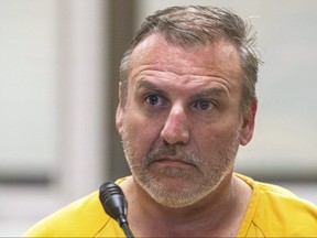 In this Oct. 9, 2019, file photo, Brian Steven Smith is arraigned on a charge of first-degree murder at the Anchorage Jail courtroom in Anchorage, Alaska.  (Loren Holmes/Anchorage Daily News via AP, File)