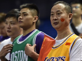 Fans wait for the start of the NBA pre-season match between the Los Angeles Lakers and the Brooklyn Nets at Mercedes Benz Arena in Shanghai on October 10, 2019. (HECTOR RETAMAL/AFP via Getty Images)