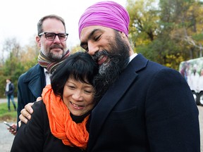 NDP Leader Jagmeet Singh, hugs Olivia Chow, widow of former NDP leader Jack Layton as they make an announcement at Jack Layton Park during a campaign stop in Hudson, Que., on Wednesday, Oct. 16, 2019.