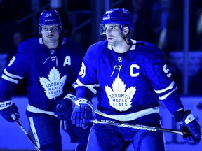 New Leafs captain John Tavares takes the ice on Wednesday with Auston Matthews to his right. THE CANADIAN PRESS