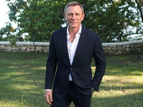 In this April 25, 2019, file photo, Daniel Craig poses for a picture during a photocall for the British spy franchise's 25th film in Oracabessa, Jamaica.