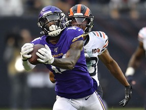 Minnesota Vikings wide receiver Stefon Diggs (14) catches the ball against Chicago Bears cornerback Kyle Fuller (23) at Soldier Field. (Quinn Harris-USA TODAY Sports)