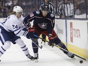 Pierre-Luc Dubois (right) leads the Blue Jackets with three goals this season. Columbus visits Toronto on Monday night. (Jay LaPrete/The Associated Press)