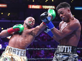Erroll Spence Jr. (right) and Shawn Porter exchange punches during their fight at Staples Center on September 28, 2019 in Los Angeles. (Jayne Kamin-Oncea/Getty Images)