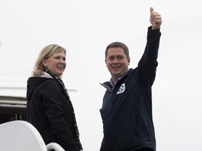 Conservative leader Andrew Scheer gives the thumbs up as he and his wife Jill board the campaign plane in Ottawa, Monday October 14, 2019.