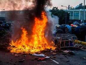 A fire lit by protesters burn in the Sha Tin district of Hong Kong on Oct. 1, 2019, as violent demonstrations take place in the streets of the city on the National Day holiday to mark the 70th anniversary of communist China's founding.