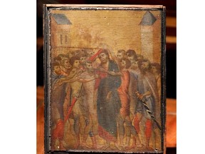 The painting "Christ Mocked", a long-lost masterpiece by Florentine Renaissance artist Cimabue in the late 13th century, which was found months ago hanging in an elderly woman's kitchen in the town of Compiegne, is displayed in Paris, France, September 24, 2019.