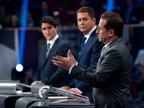 Liberal Leader Justin Trudeau (left), Conservative Leader Andrew Scheer (centre) and Bloc Quebecois Leader Yves-Francois Blanchet take part in the Federal Leaders French language debate in Gatineau, Que. on Thursday, Oct. 10, 2019.