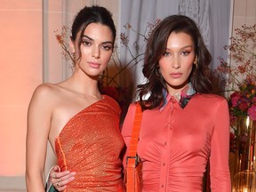 Kendall Jenner, left, and Bella Hadid attend the YouTube cocktail party during Paris Fashion Week on Sept. 26, 2018 in Paris.  (Victor Boyko/Getty Images for YouTube)
