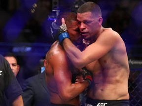 Nate Diaz, right, and Anthony Pettis show sportsmanship after their fight during their Welterweight Bout at UFC 241 at Honda Center on Aug. 17, 2019 in Anaheim, Calif. (Joe Scarnici/Getty Images)
