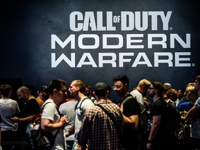 Visitors wait to try out the latest version of Call of Duty Modern Warfare during the press day at the 2019 Gamescom gaming trade fair on August 20, 2019 in Cologne, Germany.