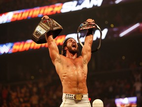 Seth Rollins celebrates his victory over John Cena at the WWE SummerSlam 2015 at Barclays Center of Brooklyn on August 23, 2015 in New York City.