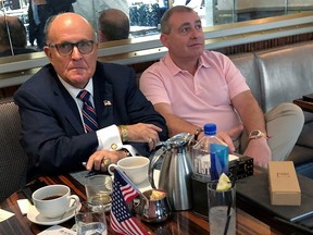 President Trump's personal lawyer, Rudy Giuliani, has coffee with Ukrainian-American businessman Lev Parnas at the Trump International Hotel in Washington, September 20, 2019. (REUTERS/Aram Roston/File Photo)
