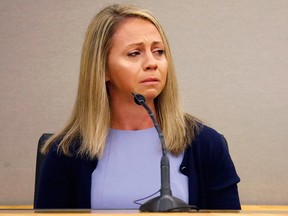 In this Friday, Sept. 27, 2019, file pool photo, fired Dallas police officer Amber Guyger becomes emotional as she testifies in her murder trial in Dallas.