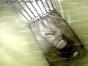 Corey Rogers, 41, lies in a police lockup cell at about 11 p.m. on June 15, 2016, where he later died, in this still image taken from surveillance video provided by Nova Scotia Courts.