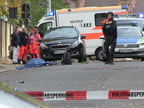 Police secure the area after a shooting in the eastern German city of Halle on October 9, 2019. (REUTERS/Marvin Gaul)