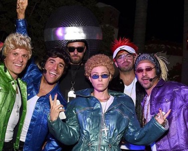 Jessica Biel, centre, dressed as ‘NSYNC-era JT, while husband Justin Timberlake was a microphone and four of their friends went as the other members of the boy band at the Casamigos party. (Justin Timberlake/Instagram)
