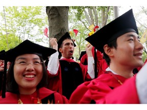 Philosophy students cheer as they receive their degrees during the 368th Commencement Exercises at Harvard University in Cambridge, Massachusetts, U.S., May 30, 2019.