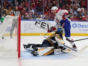 Canadiens' Joel Armia scores past Sabres goalie Carter Hutton during first-period acton in Buffalo Wednesday night.