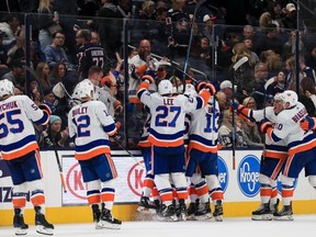 New York Islanders center Brock Nelson celebrates scoring the game winning goal against the Columbus Blue Jackets in the overtime period at Nationwide Arena.