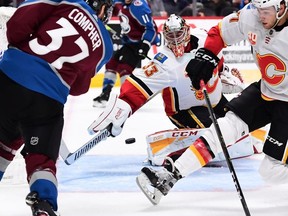 Colorado Avalanche left wing J.T. Compher scores past Calgary Flames goaltender David Rittich in the second period at the Pepsi Center.