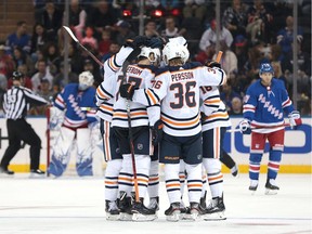 Oct 12, 2019; New York, NY, USA; Edmonton Oilers defenseman Oscar Klefbom (77) celebrates his goal against New York Rangers goaltender Henrik Lundqvist (30) with teammates during the second period at Madison Square Garden. Mandatory