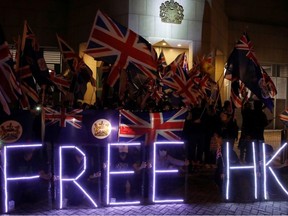 Anti-government demonstrators protest in front of the UK consulate in Hong Kong, China, October 23, 2019.