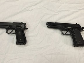 This April 28, 2016, file photo shows a semi-automatic handgun, left, next to a Powerline 340 BB gun, right, displayed during a news conference in Baltimore. A Manitoba judge is calling for new rules governing imitation firearms, in order to reduce the risk of fatal shootings involving police and so-called suicides-by-cop.