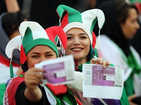 Iranian fans show their tickets during the FIFA World Cup Qualifier against Cambodia at Azadi Stadium on October 10, 2019 in Tehran, Iran. (Amin M. Jamali/Getty Images)
