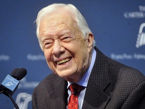 Former U.S. President Jimmy Carter takes questions from the media during a news conference at the Carter Center in Atlanta, Aug. 20, 2015.