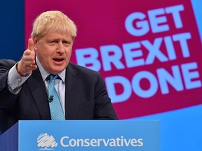 Britain's Prime Minister Boris Johnson delivers his keynote speech to delegates on the final day of the annual Conservative Party conference at the Manchester Central convention complex, in Manchester, northwest England, on Oct. 2, 2019.