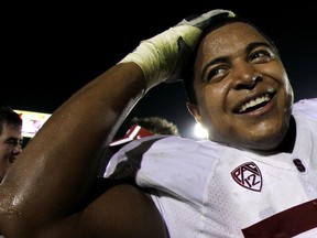 Offensive tackles Jonathan Martin of the Stanford Cardinal celebrates after the game with the USC Trojans at the Los Angeles Memorial Coliseum on Oct. 29, 2011 in Los Angeles. (Stephen Dunn/Getty Images/AFP)