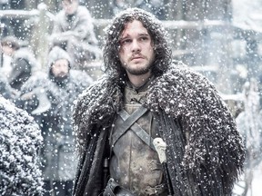 This file image released by HBO shows Kit Harington as Jon Snow, left, in a scene from "Game of Thrones." "Game of Thrones" was one of the hottest topics on Facebook in 2015. (Helen Sloan/HBO via AP, File)