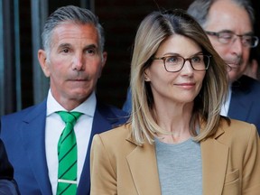 Actor Lori Loughlin, and her husband, fashion designer Mossimo Giannulli, leave the federal courthouse after facing charges in a college admissions cheating scheme, in Boston, on April 3, 2019.