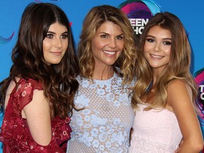 Lori Loughlin (middle) and her daughters, Bella and Olivia Jade Giannulli, attend the Teen Choice Awards held at The Galen Center. (Adriana M. Barraza/WENN.com)