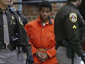 In this Dec. 4, 2002 file photo, Lee Boyd Malvo leaves a pre-trial hearing at the Fairfax County Juvenile and Domestic Relations Court in Fairfax, Va.