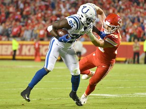 Indianapolis Colts running back Marlon Mack, left, runs the ball and is tackled by Kansas City Chiefs linebacker Ben Niemann during the first half at Arrowhead Stadium. (Denny Medley-USA TODAY Sports)