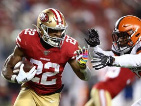 Matt Breida (left) of the 49ers runs with the ball against the Browns during NFL action at Levi's Stadium in Santa Clara, Calif., on Monday, Oct. 7, 2019.