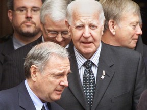 Former Nova Scotia premier John Buchanan, centre, federal Liberal leadership candidate Paul Martin, bottom, and Nova Scotia Justice Minister Jamie Muir, right, attend a memorial service for former Nova Scotia premier John Savage in Halifax on Friday, May 16, 2003.